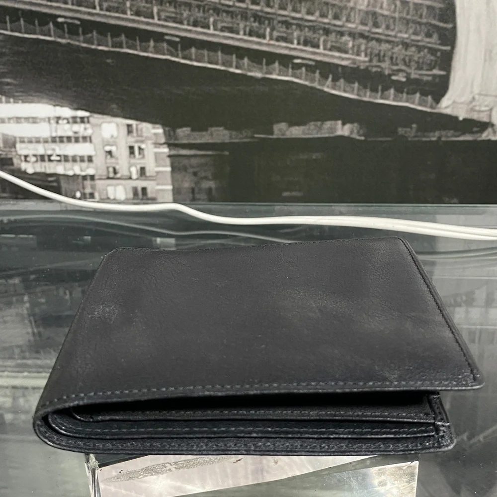 Authentic YSL Sleek black leather bifold wallet